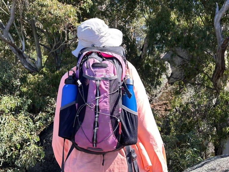 day pack and water bottles on a hiker