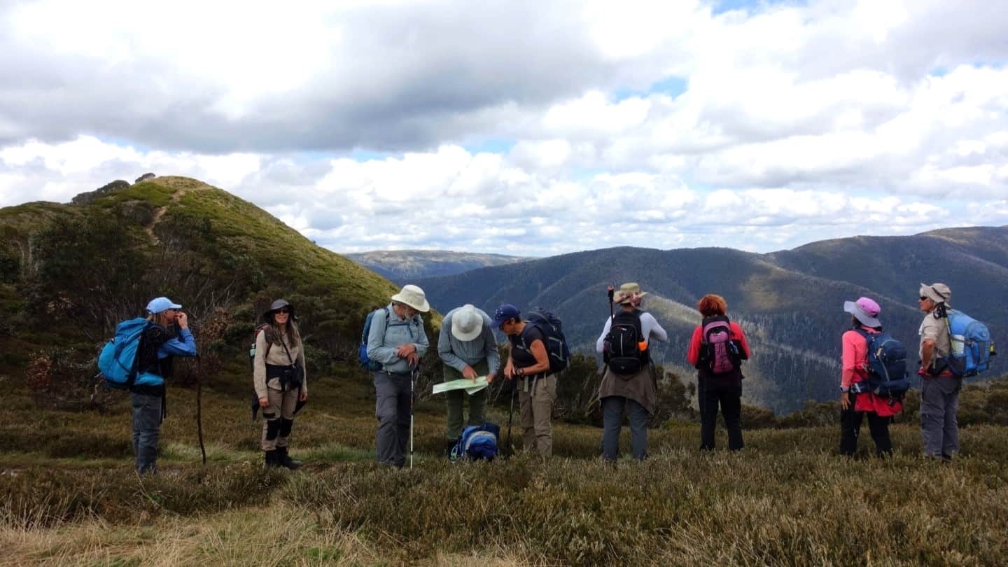 hikers consult the map on route to the Razorback ridge summit