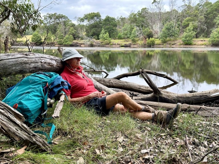 a woman taking a rest beside the Bermagui River